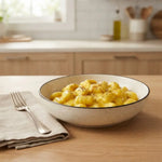 Gnocchi Keto crema allo zafferano keChef serviti in una ciotola, piatto pronto con 5g di carboidrati per 100g.